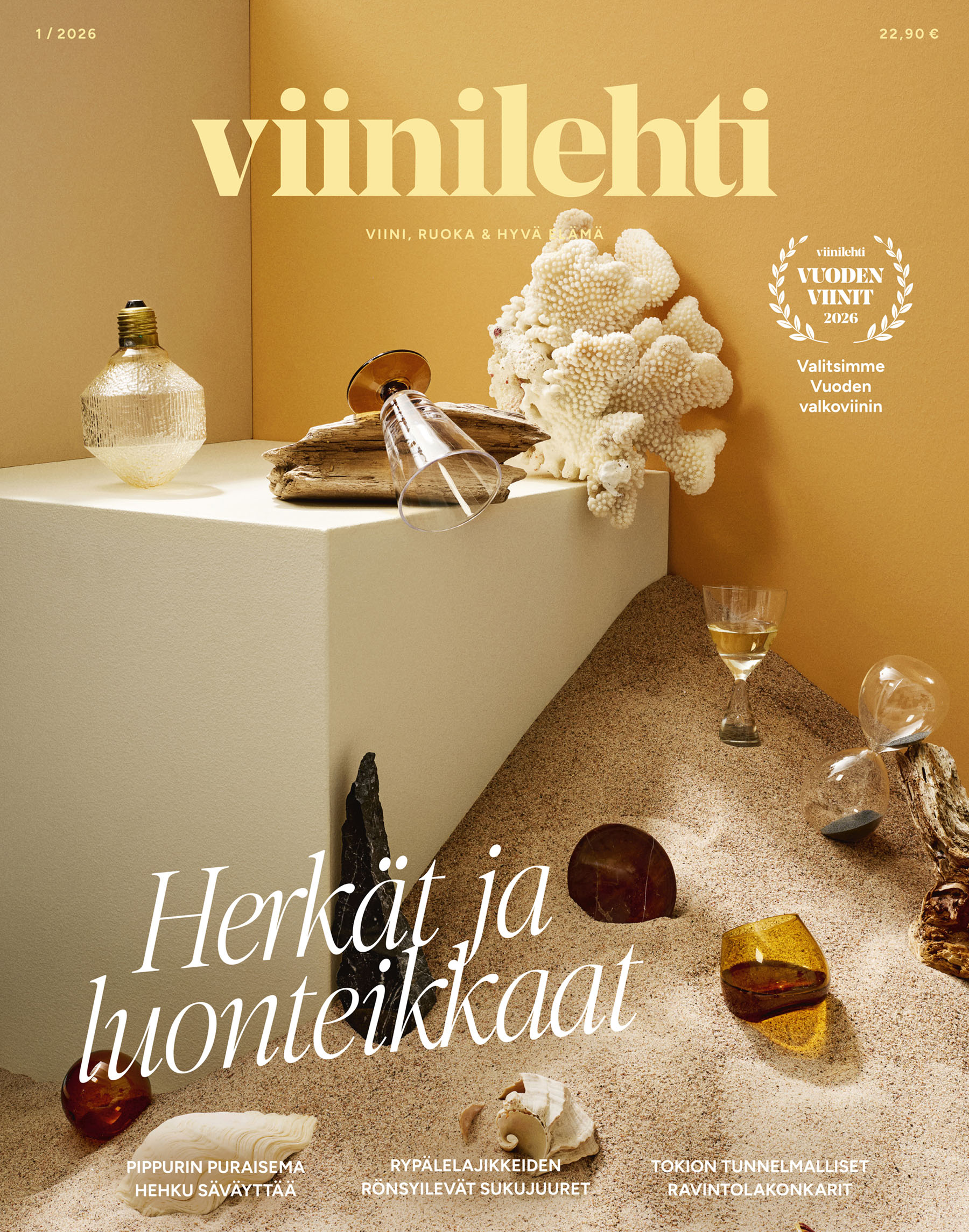 Viinilehti 2026 -kansi: keltainen tausta, isoin teksti viinilehti, lasi ja koralli hiekkasävyillä.